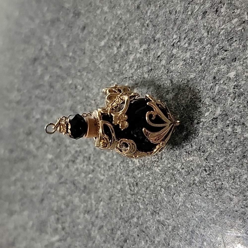 New without tags, Adjustable size Poison bottle ring Goldtone and black glass